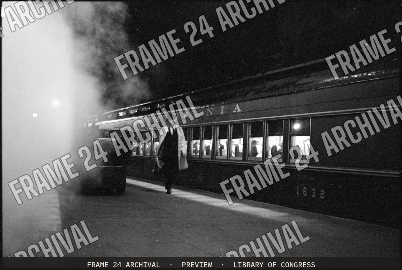 Man walking on platform next to train in station, New York City (1959), restored vintage black and white photograph