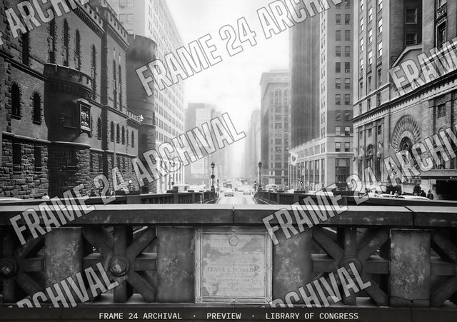 View of a city street from a bridge, vintage black and white photograph